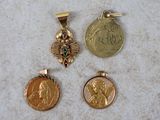 three different types of gold and silver coins on a white surface