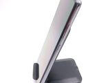a close up of a cell phone on a stand