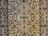 an antique persian rug with a floral design and fringe fringes