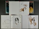 several drawings of a woman and a cat are shown on a table