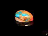 a close up of a sphere on a black surface with a black background