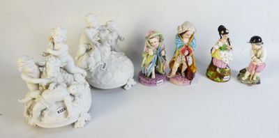 several figurines of different sizes and shapes are lined up on a white surface
