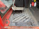 a seat in the back of a red truck