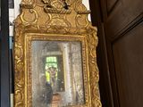 a mirror hanging on the wall next to a door