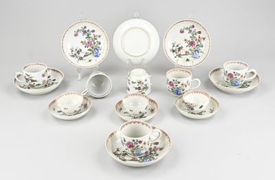 many different types of tea cups and saucers on the table