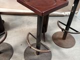 three stools that are sitting next to each other on the floor