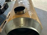 a large metal pipe that is sitting on the floor