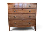 an image of a wooden chest of drawers on a white background