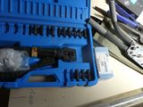 a blue tool box with tools in it on a table