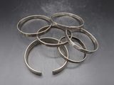 a close up of a bunch of rings sitting on top of a table