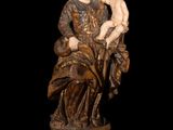 an image of a statue of a woman holding a child
