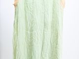 an image of a green dress hanging on a hanger