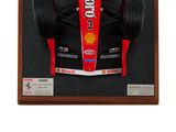 a picture of a model of a racing car in a display case