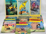 a bunch of children ' s books sitting on top of each other