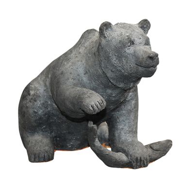 a statue of a bear that is sitting on its hind legs