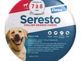 the dog is sitting in front of a button with the words seresto on it