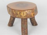 an image of a small wooden stool with two legs on a white background
