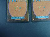two cards that are sitting on a table