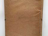 an old brown paper bag with a string on it