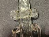 a glass figurine that is sitting on a table