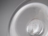 a close up view of a silver plate with a hole in it