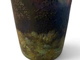 a vase that has a picture of a tree on it