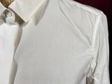a mannequin wearing a white shirt and tie on a mannequin