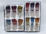 six different colored wine glasses in a box