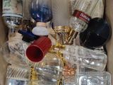 a box full of empty glass bottles and other items