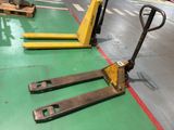 two pallets sitting on the floor in a warehouse