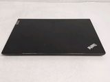 a laptop that is sitting on a white surface