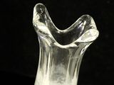 a glass vase that is sitting on a table