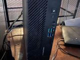a desktop computer sitting on top of a wooden desk