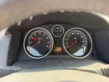 a close up of a car dashboard with gauges and speedometers