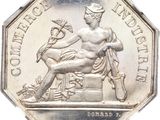 an image of a silver coin with a statue of a woman and a bird on it