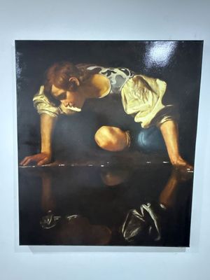un tableau représentant un jeune garçon penché sur une table