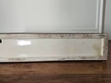 a white box sitting on top of a wooden table