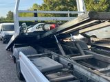 a flatbed truck with a flat bed on the back of it ' s flatbed