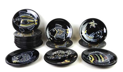 a lot of plates that have different designs on them