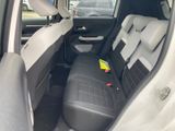 the back seat of a car with a yellow sticker on it