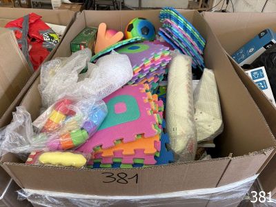 a cardboard box filled with toys and other items
