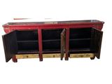 a red and black cabinet with two open doors