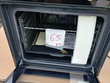 a black oven that has a sign on the door