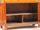 a wooden cabinet with two doors open on a white surface