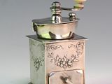 a small silver box with a bowl on top of it