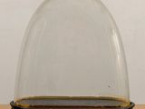 a close up of a glass dome on top of a wooden table