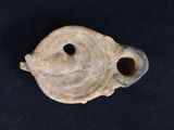 an image of a piece of pottery with a face on it