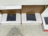 three open boxes sitting on the floor next to each other