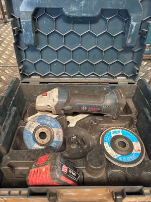 a tool box with tools inside of it on the floor