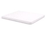 gros plan d'un matelas sur une surface blanche